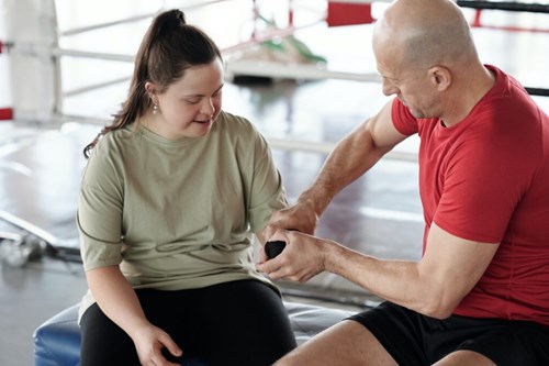 NDIS women doing exercise with a trainer