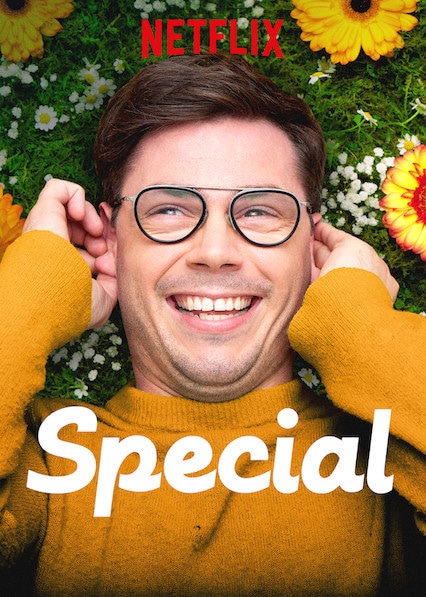 Image is Ryan O'Connell (Special main character) with glasses on. He is smiling and has his hands covering his ears