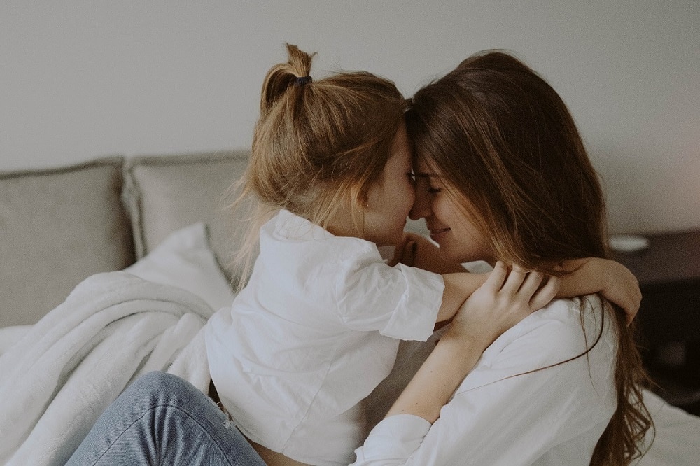 A mum and daughter embracing