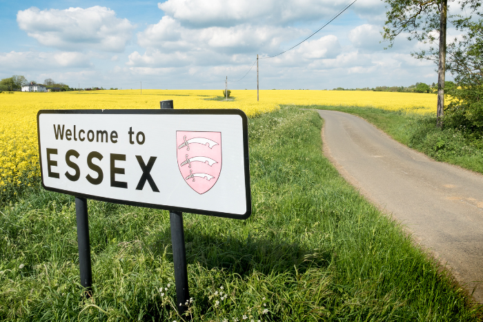 An image of a field with a sign that reads 'Welcome to ESSEX'.