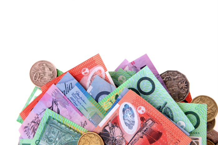 A colourful arrangement of Australian money, including notes and coins.