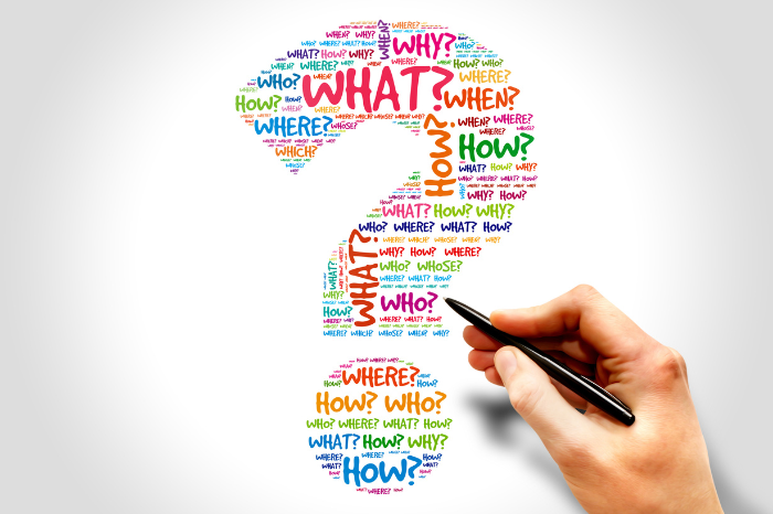 A large, colourful question mark is formed by the words 'What?' 'How?' 'When?' Where?' and 'Who?'