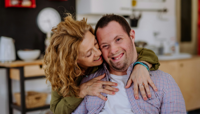 Two people close up smiling.